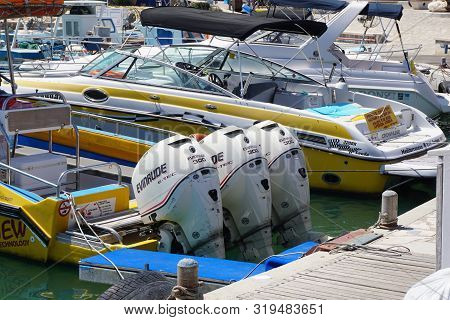 Aya Napa, Cyprus - September, 10, 2015: Rent A Boat. Three Powerful Engines Evinrude 300 Mounted On 