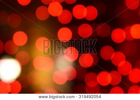 Red Christmas Bokeh With Light Beautifully Little Lights. Blurred Background. Place For Your Text, M