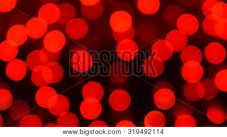 Red Christmas Bokeh With Light Beautifully Little Lights. Blurred Background. Place For Your Text, M