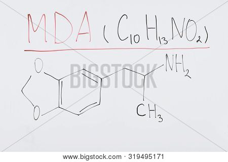 Top View Of White Board With Chemical Formula And Lettering Mda