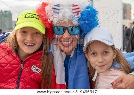 Russia, Kazan - August 27, 2019: Close-up Portrait Of A Smiling Fans: Two Adorable Russian White Kid
