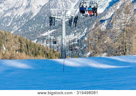 Ski Resort Folgarida Marilleva.folgarida Marilleva.italy.15.02.2019. People Rise On A Chair Lift.