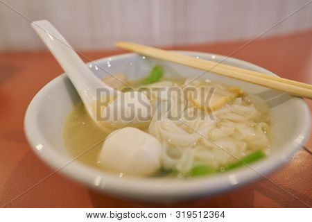Close up shot of Kway Teow soup at a lounge.