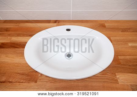 Closeup Brown Teak Wooden Empty Tabletop With White Round Ceramic Sink. Concept Repair, Bathroom Ren