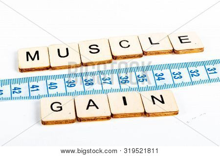 Health Concept Of A Tape Measure Also Showing The Message Muscle Gain