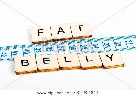 Health Concept Of A Tape Measure Also Showing The Message Fat Belly