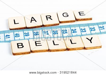 Health Concept Of A Tape Measure Also Showing The Message Large Belly