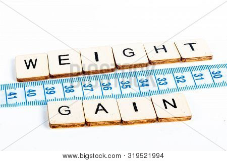 Health Concept Of A Tape Measure Also Showing The Message Weight Gain