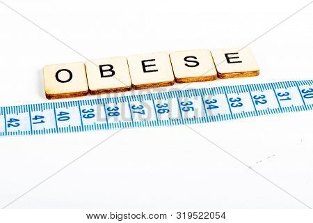 Health Concept Of A Tape Measure Also Showing The Message Obese