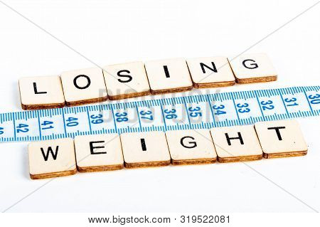 Health Concept Of A Tape Measure Also Showing The Message Losing Weight