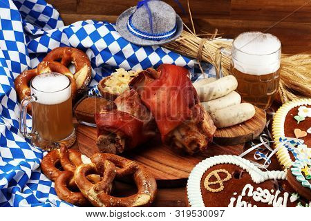 Traditional German Cuisine, Schweinshaxe Roasted Ham Hock. Beer, Pretzels And Various Bavarian Speci