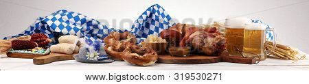 Traditional German Cuisine, Schweinshaxe Roasted Ham Hock. Beer, Pretzels And Various Bavarian Speci