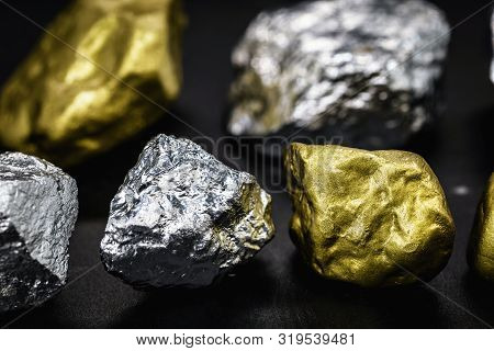 Gold And Silver Nuggets On Black Background. Precious Stones, Luxury Concept And Mineral Drainage. I
