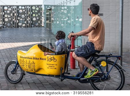 Amsterdam, The Netherlands - June 30, 2019: Closeup Of Bakfiets, Front-trunk Bike To Transport A Loa