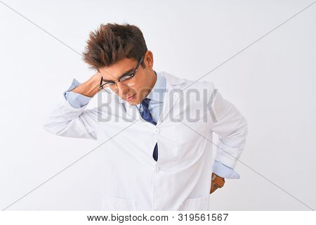 Young handsome sciencist man wearing glasses and coat over isolated white background Suffering of neck ache injury, touching neck with hand, muscular pain