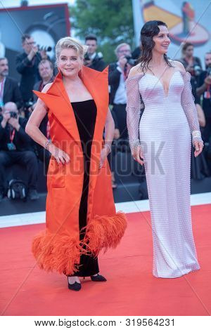 Juliette Binoche and Chaterine Deneuve  walks the red carpet ahead of the Opening Ceremony  during the 76th Venice Film Festival at Sala Grande on August 28, 2019 in Venice, Italy. 