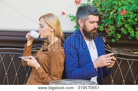 Couple In Love Sit Cafe Terrace Enjoy Coffee. Man Secret Messaging Cheating On Wife. Cheat And Betra