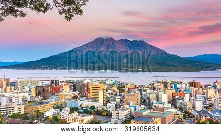 Kagoshima, Japan skyline with Sakurajima Volcano at dusk.