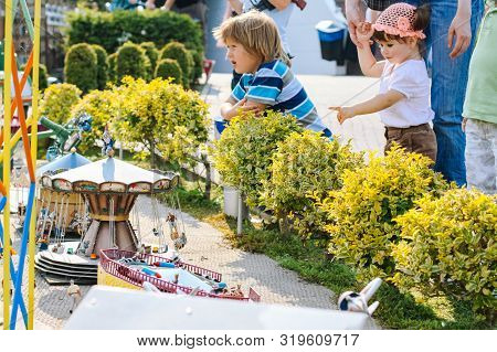 Netherlands. Den Haag. Miniature Park Madurodam. August 2010. Little Girl To Point With A Finger Som