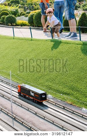 Netherlands. Den Haag. Madurodam.august 2010. Girl Look Down On The Miniature Road In Madurodam Park