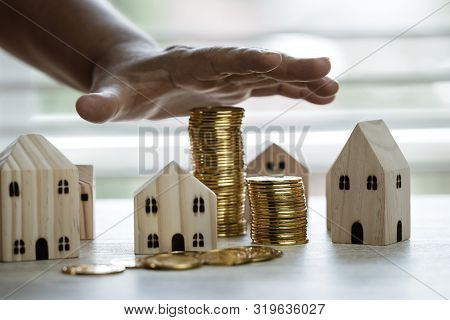 Insurance In Business Real Estate Investment Or Loan Buyer Concept : Businessman Hand Cover Miniatur