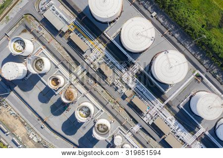 Aerial View Of Chemical Industry Storage Tank And Tanker Truck In Wailting In Industrial Plant To Tr