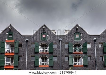 Amsterdam, The Netherlands - July 1, 2019: Gables And Facade Of Warehouse Transformed Into Apartment