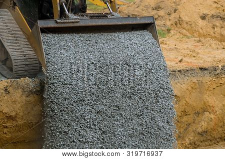Excavator Bucket Backfilling Trench For Stone Backfill Of Foundation Excavator Bucket Working