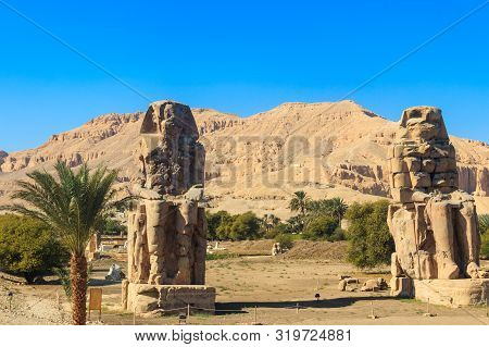 Colossi Of Memnon, Two Massive Stone Statues Of Pharaoh Amenhotep Iii In Luxor, Egypt