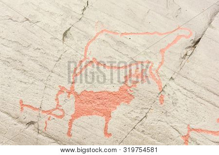 Rock Art In Alta Fjord, Norway. Ancient Symbols, Real Drawing,  Texture In Stone. Red Ocher Paint. H