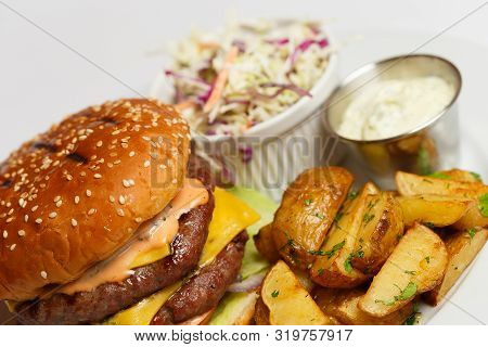 Burger With Double Pork Chop And Baked Potatoes
