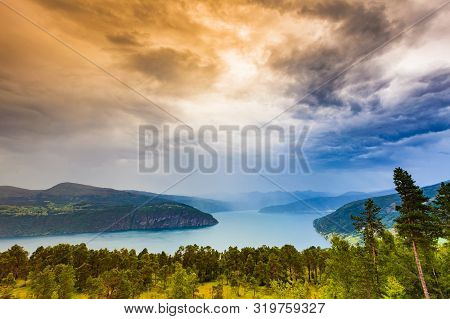 Norwegian Landscape. Green Mountains Hills And Fjord, Stormy Rainy Weather.