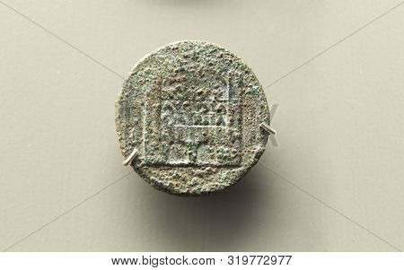 Merida, Spain - December 20th, 2017: Bronze Dupondius Depicting Merida Roman City Door. National Mus