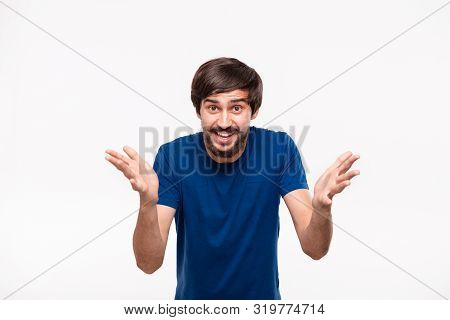 Handsome Brunet Man In A Blue Shirt With Beard And Mostaches Shouting Shrugging His Shoulders Being 