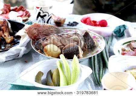 Table Setting In Nature. Boiled Fish On The Table.