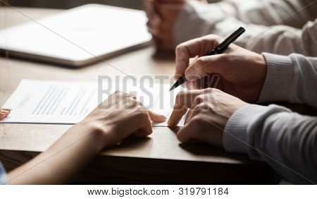 Solicitor Pointing At Contract Showing Client Where To Write Signature