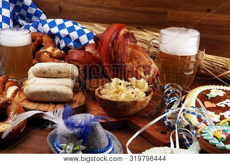 Traditional German Cuisine, Schweinshaxe Roasted Ham Hock. Beer, Pretzels And Various Bavarian Speci