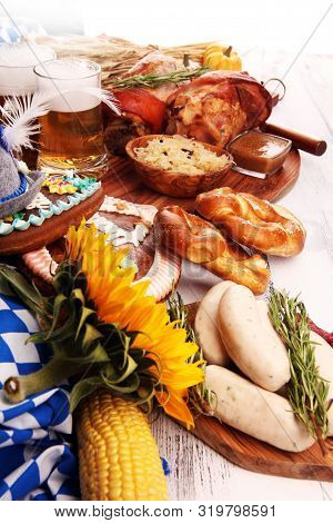 Traditional German Cuisine, Schweinshaxe Roasted Ham Hock. Beer, Pretzels And Various Bavarian Speci