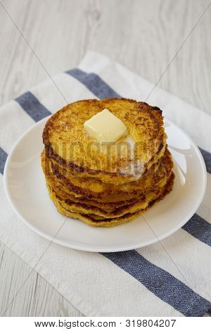 Homemade Corn Meal Johnny Cakes With Butter On A White Plate, Low Angle View. Close-up.