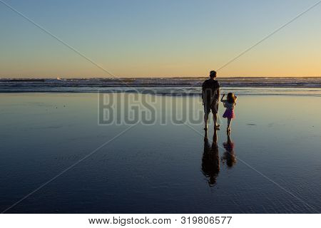 Sunset At Piha Beach, North Island, New Zealand