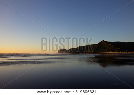Sunset At Piha Beach, North Island, New Zealand