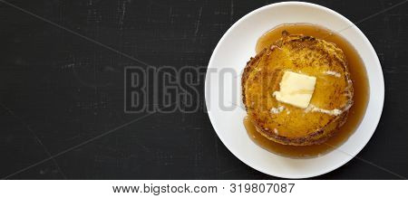 Homemade Corn Meal Johnny Cakes On A White Plate On A Black Surface, Top View. Flat Lay, Overhead, F