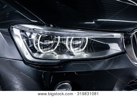 Novosibirsk, Russia - August 19, 2019:  Bmw X4 ,black Car Headlights. Exterior Detail. Close Up Deta