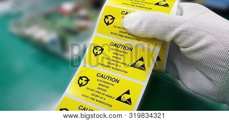 Hand Holding Esd Symbol Label With Antistatic Gloves,electrostatic Sensitive Devices (esd) In Electr