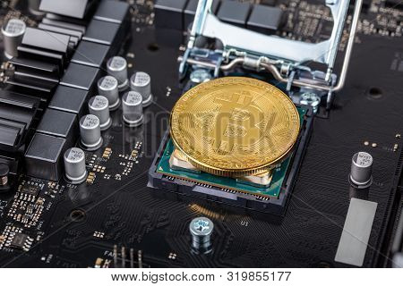 Bitcoin Physical Shiner In Cpu Socket Of Modern Cpu Motherboard With Selective Focu And Blur