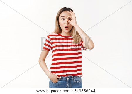 Wondered Amused Emotive Blond Asian Woman Drop Jaw Folding Lips Wow Sound Stare Camera Excited Amaze