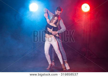 Social Dance, Kizomba, Salsa And Semba Concept - Young Beautiful Couple Dancing Bachata Or Salsa In 