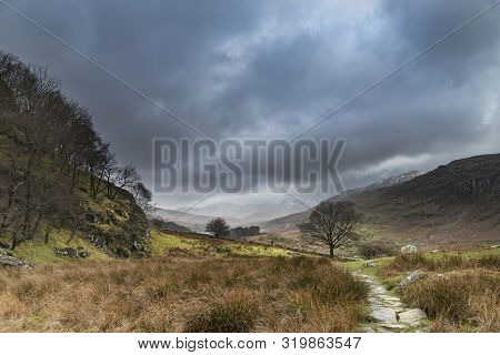 Beautiful Winter Landscape Image Looking Along Valley From Crimpiau Towards Mount Snowdon In The Dis
