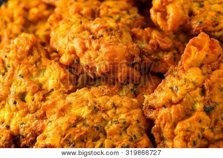 Indian Takeaway Food, Spicy Onion Bhajis On Black Plate