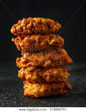 Indian Takeaway Food, Spicy Onion Bhajis On Black Plate